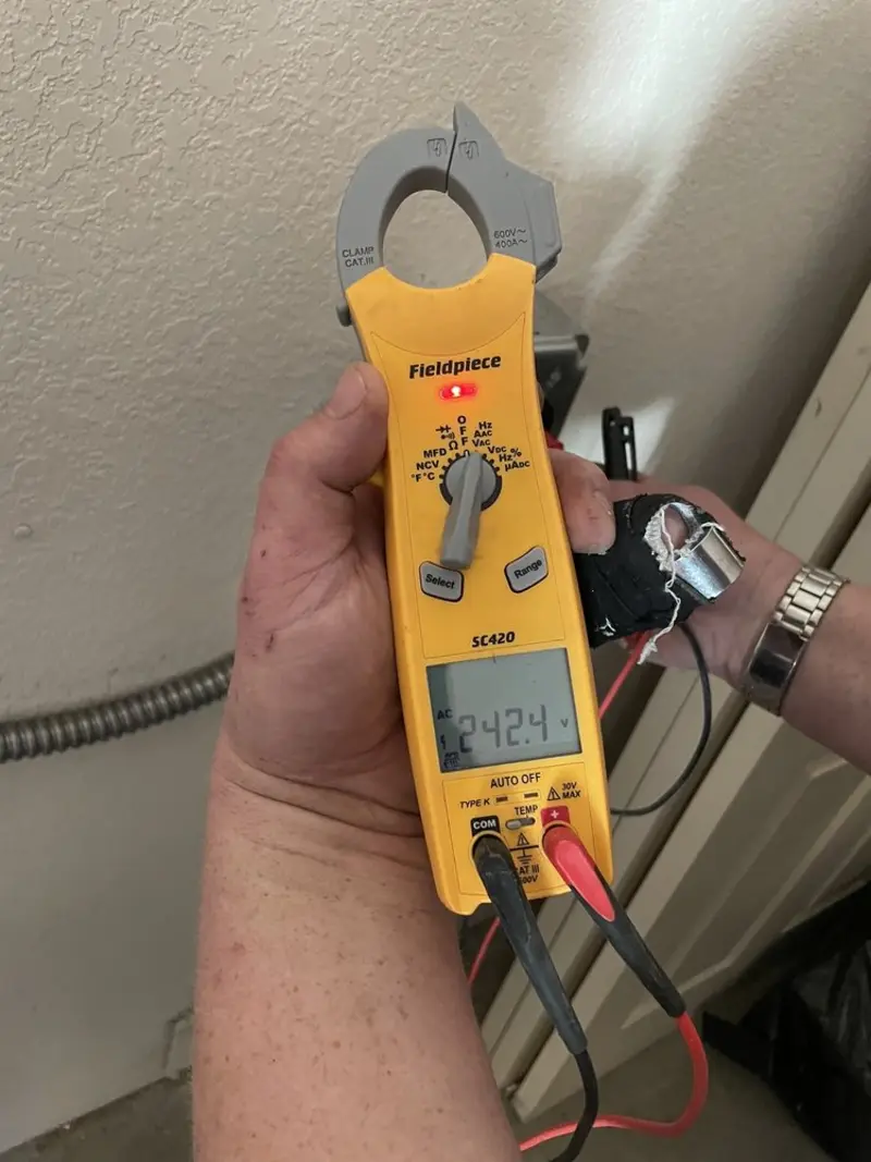 Voltage testing with clamp meter during Electrical Installation Services in Howards Grove